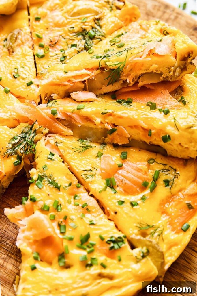 Savory Smoked Salmon and Dill Frittata 3 Close up shot of salmon frittata slices cross section stacked on top of each other