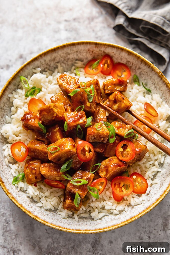 bowl of hoisin glazed tofu and chopsticks