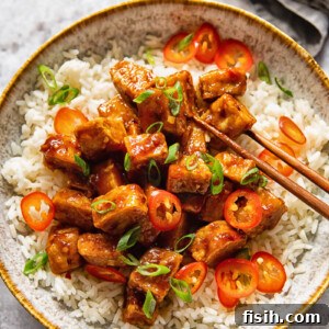 bowl of hoisin glazed tofu and chopsticks