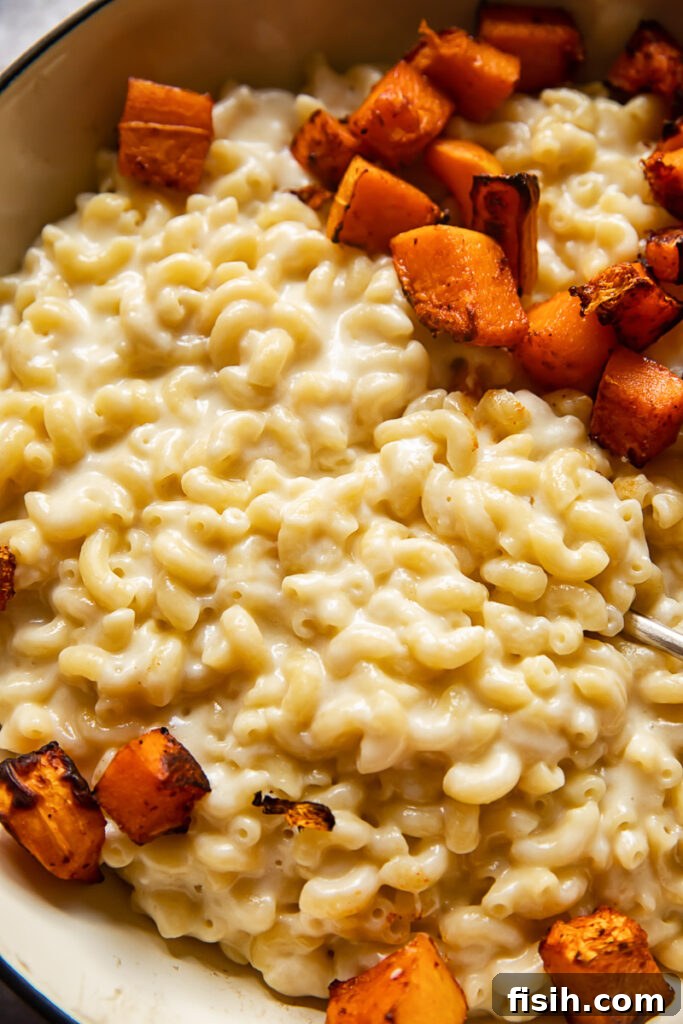 Close up of the butternut squash mac and cheese in a baking dish, ready to serve