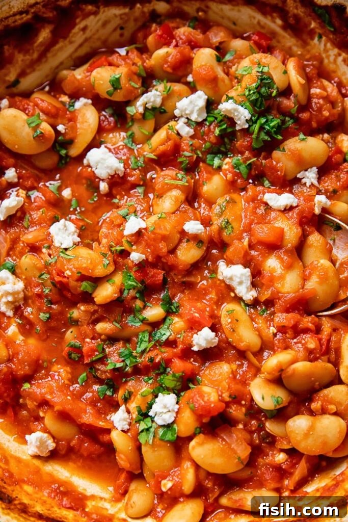 Butter bean stew with added herbs in a pan