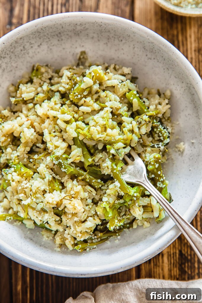 Close up of a small bowl with risotto and a fork
