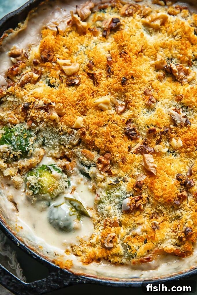 Crispy Topped Brussels Sprouts Gratin 2 Close up shot of cheesy Brussels sprouts gratin in a deep pan topped with breadcrumbs