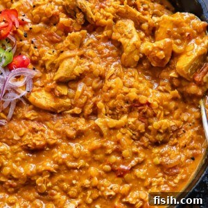 Top down shot of turkey and lentil curry in a wide pan