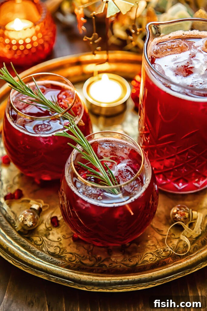Top down shot of three Christmas punch glasses on a tray, ready for serving.