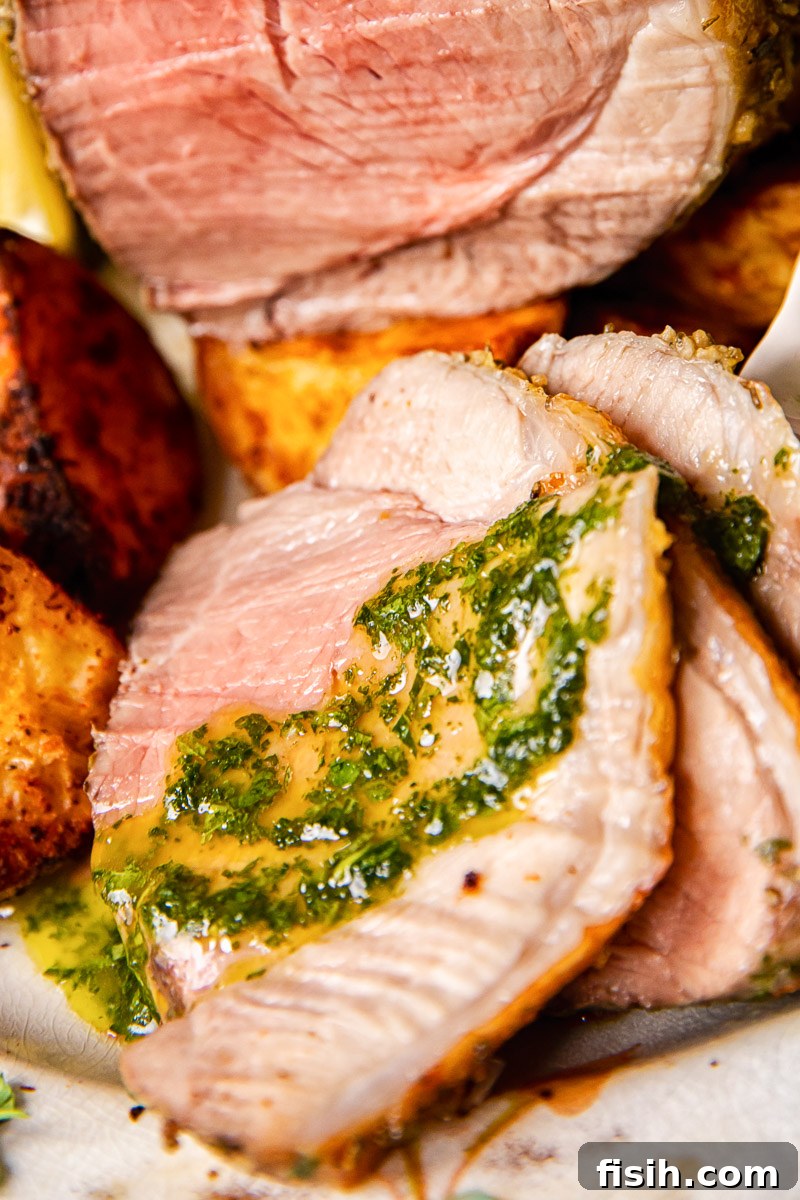 Herbed Roast Lamb Leg with Zesty Mint Drizzle 6 mint sauce spread over a slice of roast lamb