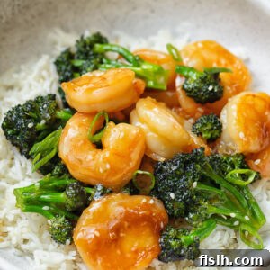 Vibrant Shrimp and Broccoli Stir-Fry 6 Close up shot of shrimp and broccoli stir fry on top of a bowl of rice
