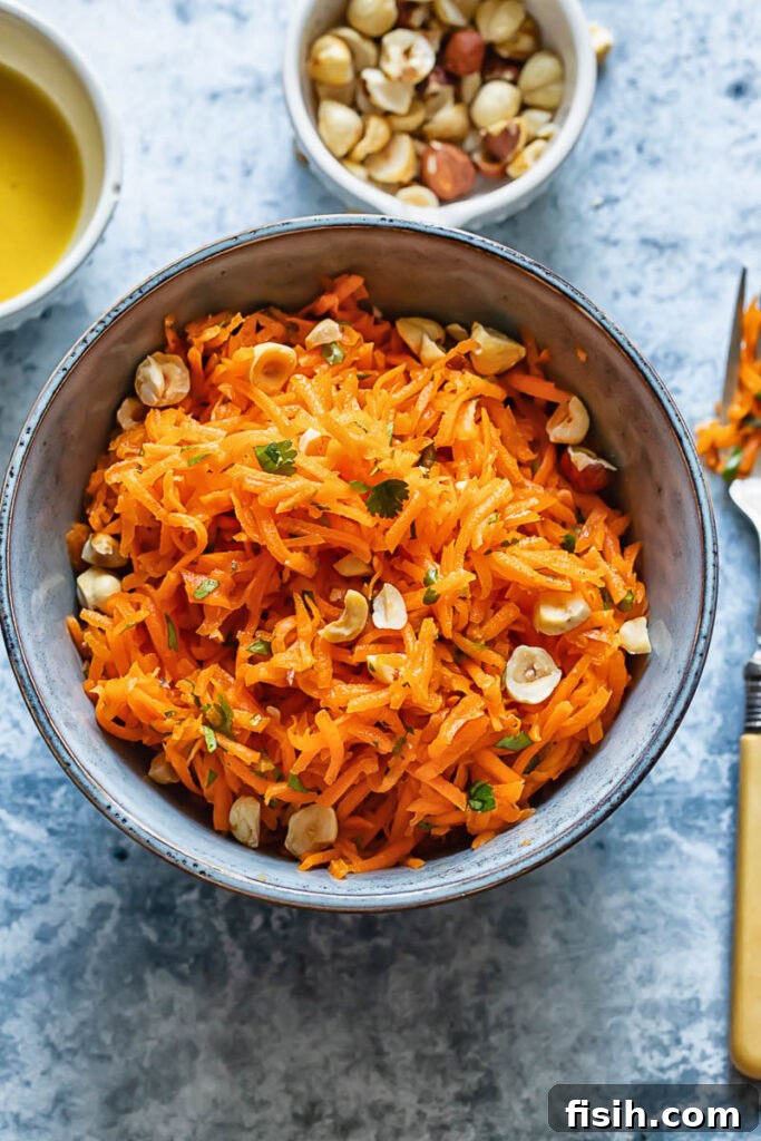 Vibrant French Carrot Salad with Toasted Hazelnut Crumble 2 Top down shot of french carrot salad in a small bowl