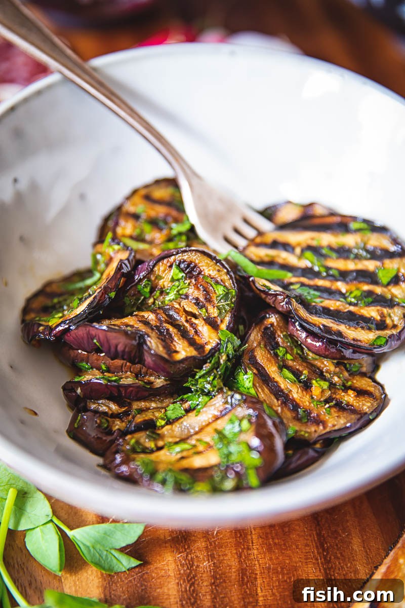 Ultimate Bruschetta Trio 5 Succulent Balsamic Grilled Eggplant with Mint topping on bruschetta slices.