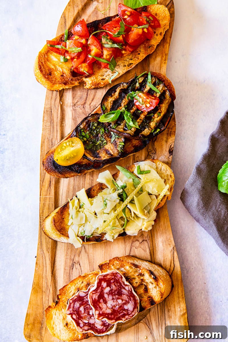 Ultimate Bruschetta Trio 7 Four bruschetta slices with various vibrant toppings elegantly arranged on a rustic wooden board, perfect for a party.