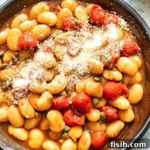 Creamy Butter Beans with Balsamic Burst Tomatoes 6 Top down shot of butter beans with cherry tomato sauce in a pan