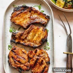 Top down shot of grilled teriyaki pork chops on a serving platter