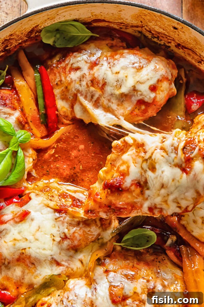 Close up of melted cheese on chicken marinara