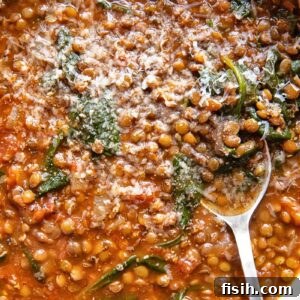 Top down of lentil and spinach soup in a large bowl
