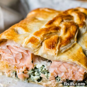 salmon en croute close up with salmon exposed
