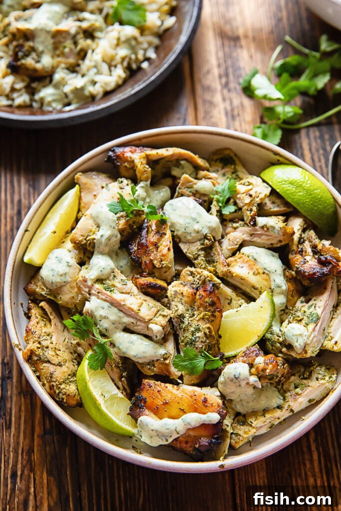 Top down shot of cilantro lime chicken in a bowl with creamy sauce