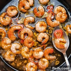 Close up shot of prawns with chilli oil in a pan