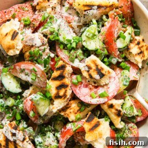 tomato and cucumber salad with grilled pita