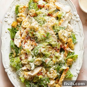 Top down view of chicken Caesar pasta salad on a serving platter