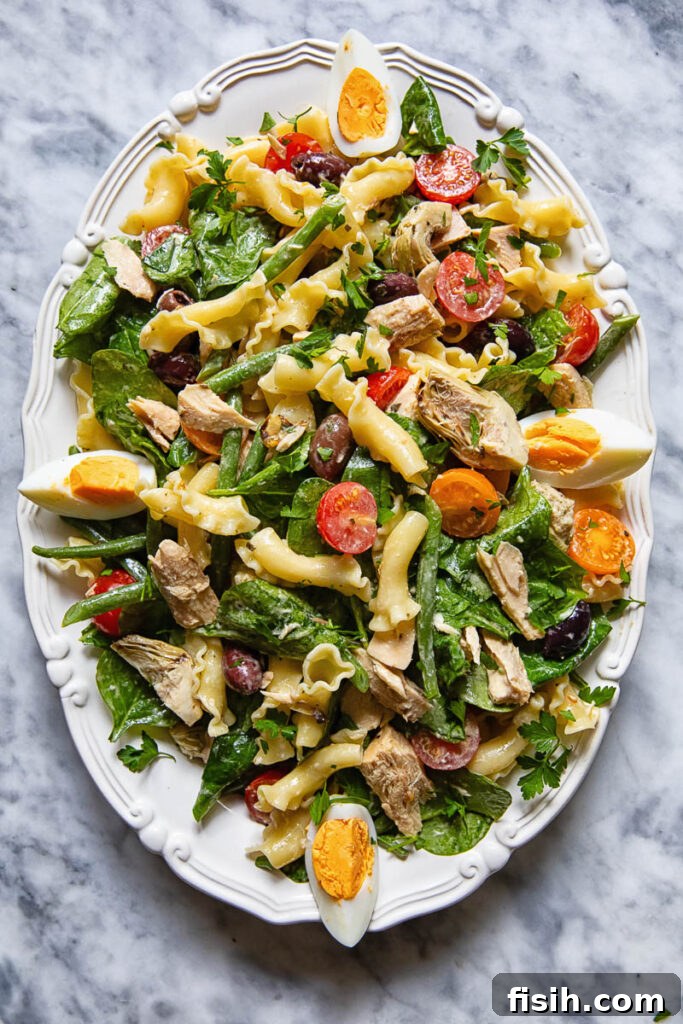 Mediterranean Tuna Nicoise Pasta Salad with Olives 2 Top down shot of Nicoise pasta salad on a serving platter