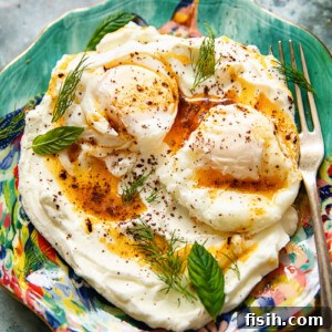 Colourful plate of Turkish eggs with a fork