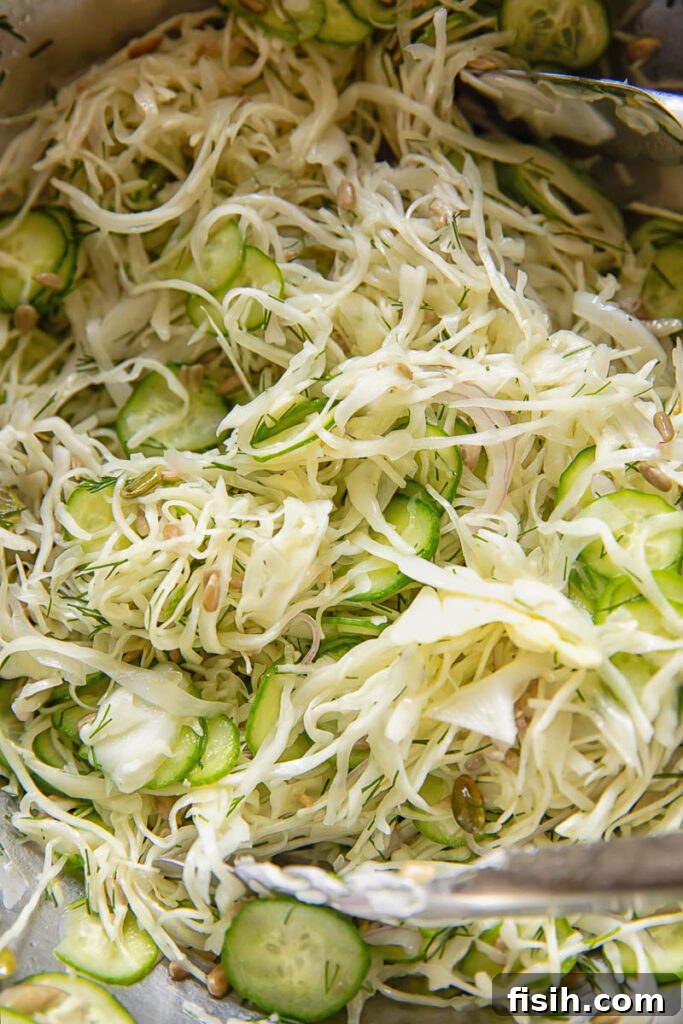 Crunchy Cabbage and Cucumber Salad with Dill Vinaigrette 3 Close up of cucumber and cabbage slaw