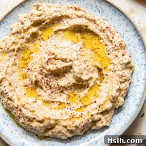 top down view of baba ganoush spread on blue plate