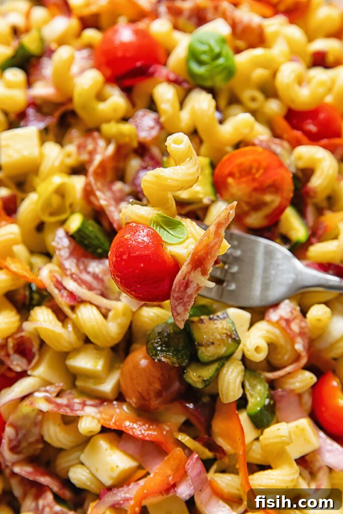 Italian Pasta Salad with Fresh Herbs and Cherry Tomatoes 3 vertical extreme close up shot of Italian pasta salad