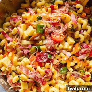 Italian Pasta Salad with Fresh Herbs and Cherry Tomatoes 5 vertical shot of Italian pasta salad oil a sliver bowl