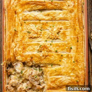 Top down shot of chicken and leak pie in a ractangular baking dish