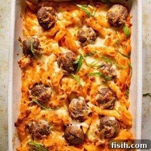 top down view of baked pasta with meatballs in a pan